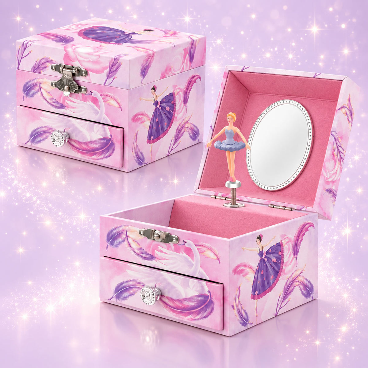 A pink music box jewelry box with ballerina illustrations, shown both closed and open. The open box reveals a pink interior, a small ballerina figurine on a music stand, and an oval mirror.