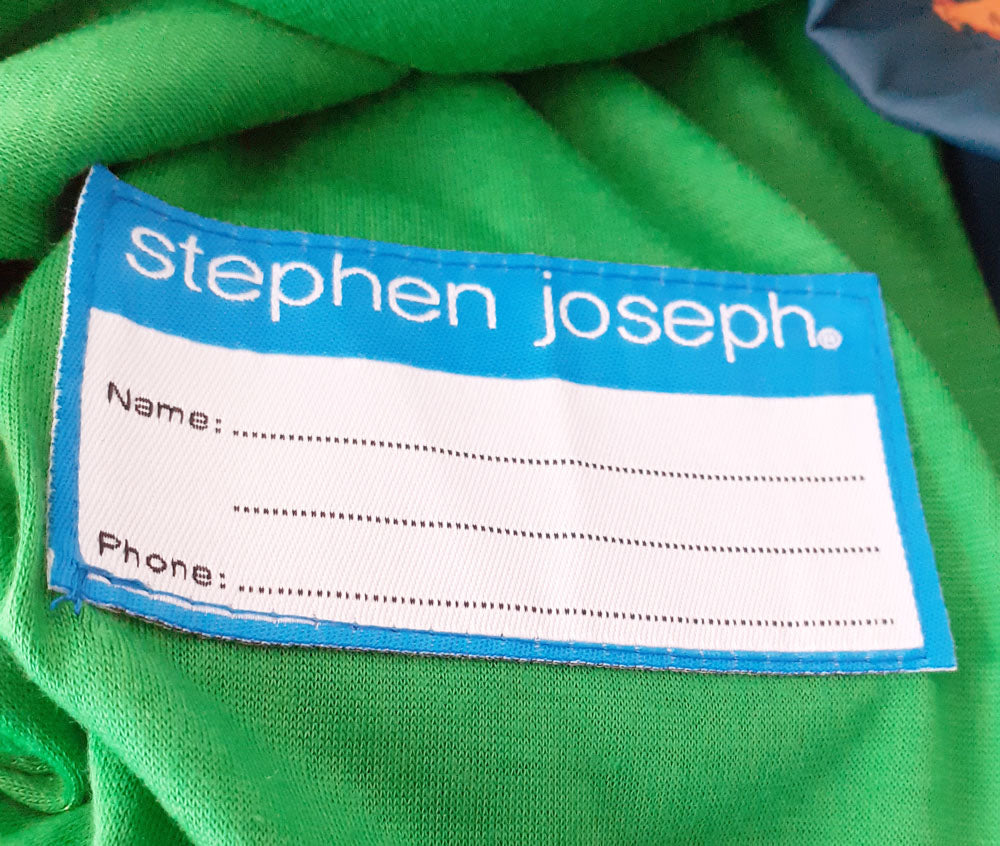Dinosaur raincoat label detail