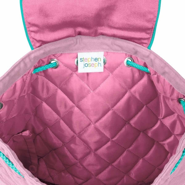 Inside of a pink unicorn backpack