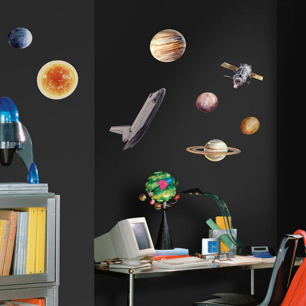 Space travel wall decals in a children’s room