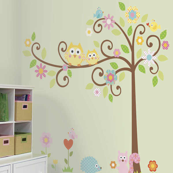 Scroll tree wall decal in a children’s room