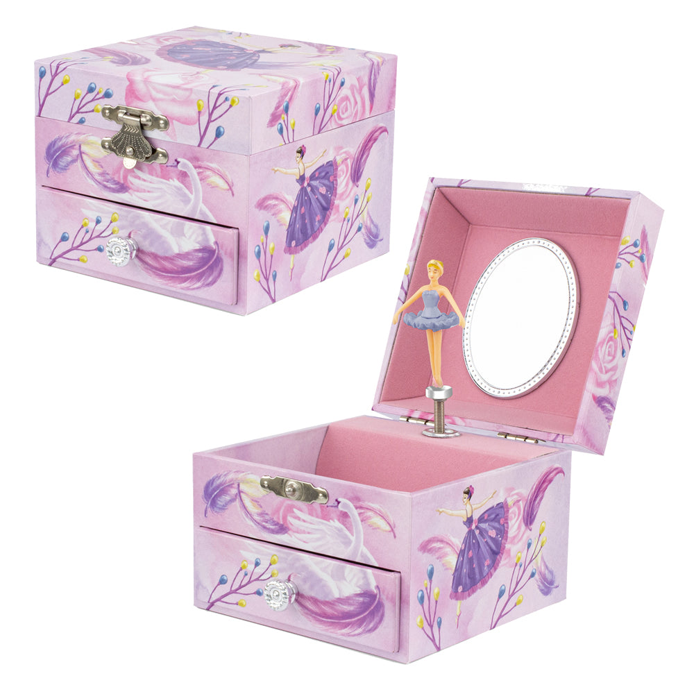 A pink ballerina-themed music box jewelry box shown closed and open, featuring purple ballerina illustrations, a small mirror inside the open lid, and a miniature ballerina figure on a stand.